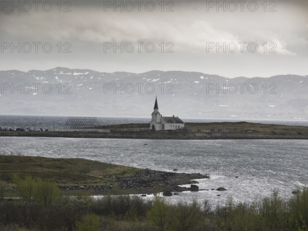 Nesseby town church, with congregation standing outside on Whit Sunday, May, Varanger Fjord, Norway, Europe