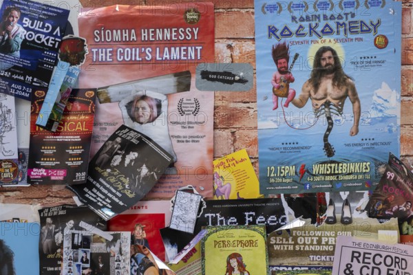 Posters and advertising cards on a wall, world's largest cultural festival The Fringe, High Street, Edinburgh, Scotland, United Kingdom, Great Britain, Europe