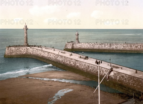 The Pier in Whitby, a historic harbour town on the North Sea coast of Yorkshire in England, c. 1890, Historic, digitally restored reproduction from a 19th century original The Pier in Whitby, a historic harbour town on the North Sea coast of Yorkshire in England, c. 1890, Historic, digitally restored reproduction from a 19th century original