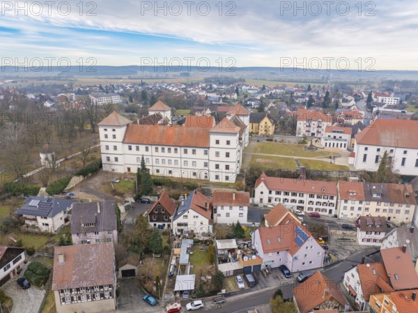 Historic castle surrounded by small houses and rural landscape under a cloudy sky, Meßkirch, district of Sigmaringen, Germany, Europe