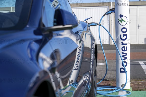 Electric car fast charging station, from the Dutch provider PowerGo, in the ferry harbour of Eemshaven, powered by renewable energy, Netherlands