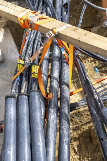 Supply lines, laid underground, exposed during a construction project, Bochum, North Rhine-Westphalia, Germany, Europe