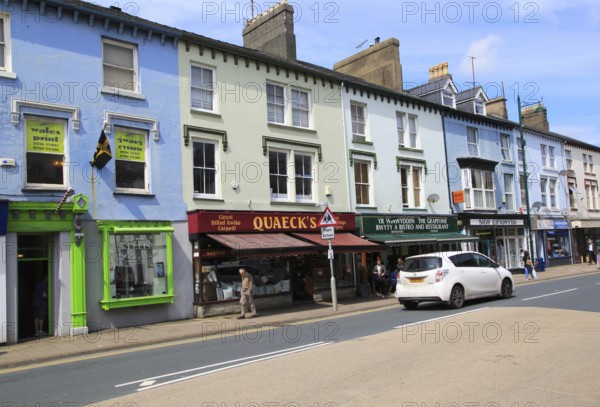 Row of shops in town centre of Porthmadog, Gwynedd, north west Wales, UK