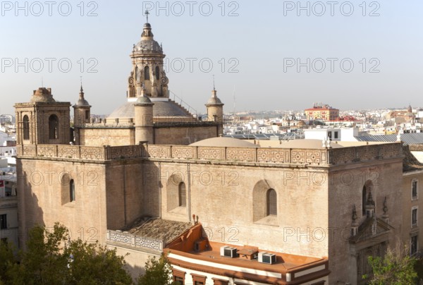 Cityscape view over rooftops the Iglesia de la Anunciación in foreground, Seville, Spain, Europe