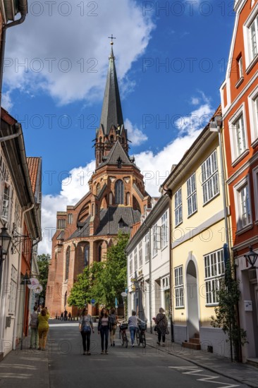 The old town of Lüneburg, view over the Lüner Straße to the St. Nicolai Church, Lower Saxony, Germany, Europe