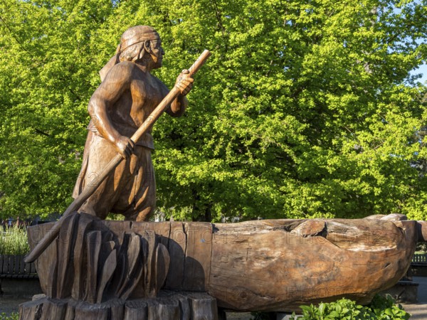 Wooden sculpture of man in a boat, central plaza, plaza de armas, Pucon, La Auracania, Chile, South America