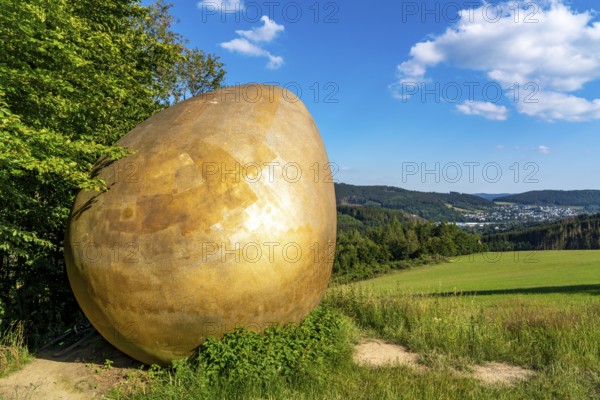 Forest Sculpture Trail Wittgensteiner Sauerland, 23 kilometre long trail, part of the Rothaarsteig, sculpture Was Was Zürst?, large golden egg, landscape in the Sauerland, Rothaargebirge, north-west, above the town of Bad Berleburg, North Rhine-Westphalia, Germany, Europe