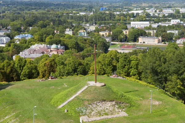 Large wooden cross on a green hill above the urban landscape, Wysoka Górka, Wysoka Gorka, Chelmska Hill, Chelmska, Jubilee Cross on the Independence Hill, Chelm, Chelm, Cholm, Lublin Voivodeship, Poland, Europe