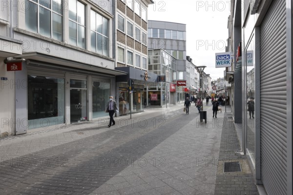 Krefeld, North Rhine-Westphalia, Germany - Krefeld city centre in times of the corona crisis during the second lockdown, most shops are closed, some shops are empty, only a few passers-by are walking on Hochstraße, the main shopping street