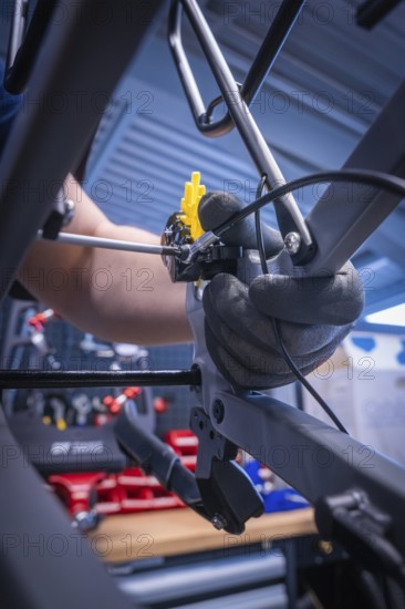 Close-up of a bicycle brake assembly process in a workshop, Waldbike Manufaktur, bicycle workshop, Calw, district of Calw, Black Forest, Germany, Europe