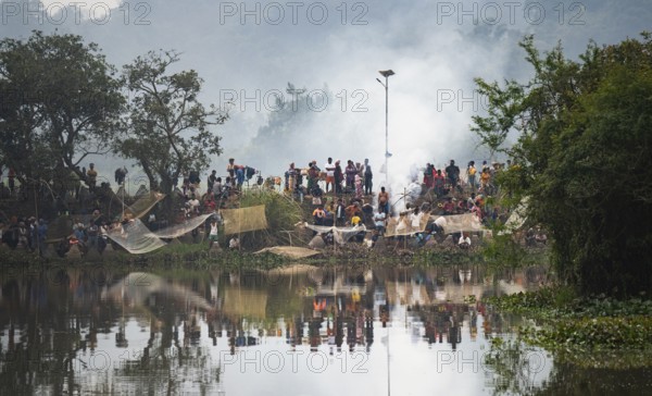 Villagers participate in a community fishing event on the occasion of the Bhogali Bihu festival at Panbari village in Assam on 13 January 2025. Magh Bihu, also known as Bhogali Bihu, is one of the most vibrant festivals celebrated in Assam and other parts of Northeast India