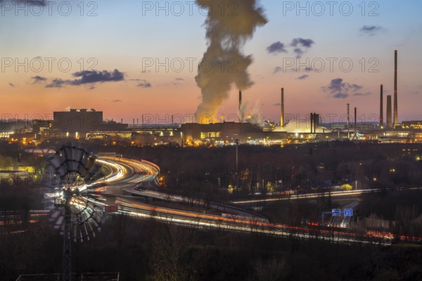 Skyline of the Duisburg steel site, Thyssenkrupp Steel Europe, in Duisburg-Bruckhausen, sunset, industrial backdrop, North Rhine-Westphalia, Germany motorway A42, Emscher expressway, Schwelgern coking plant, extinguishing cloud, release cloud, water vapour