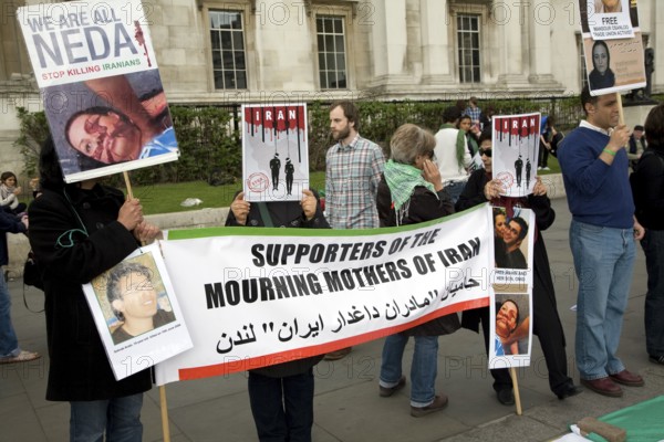 May Day march and rally at Trafalgar Square, London, England, UK May 1st, 2010 Silent protestors against regime in Iran