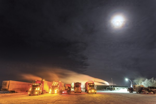 Truck, trucks, running engine, snow, winter, cold, Arctic, night shot, Eagle Plaines, Dempster Highway, Yukon, Canada, North America