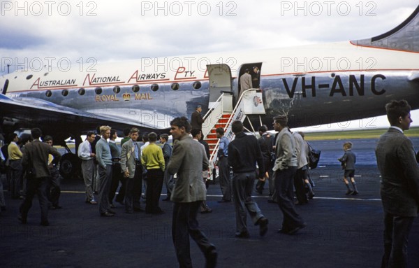 Australian National Airways VH ANC Douglas DC4 aircraft passengers boarding, Royal Mail emblem, Australia 1956 Melbourne Grammar School boys