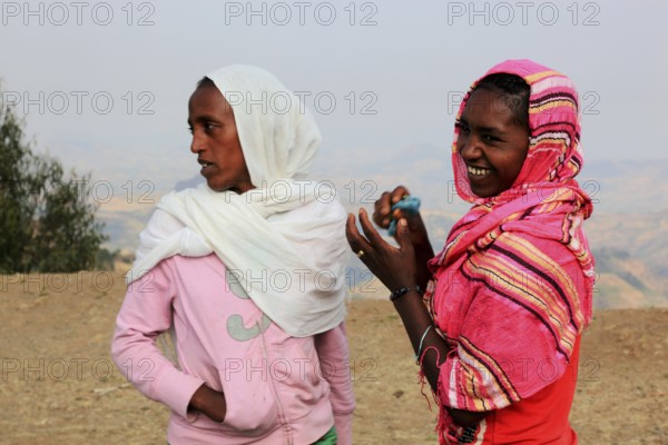 In the highlands of Abyssinia, Semien Mountains, young woman in colourful shawls, Ethiopia, Africa