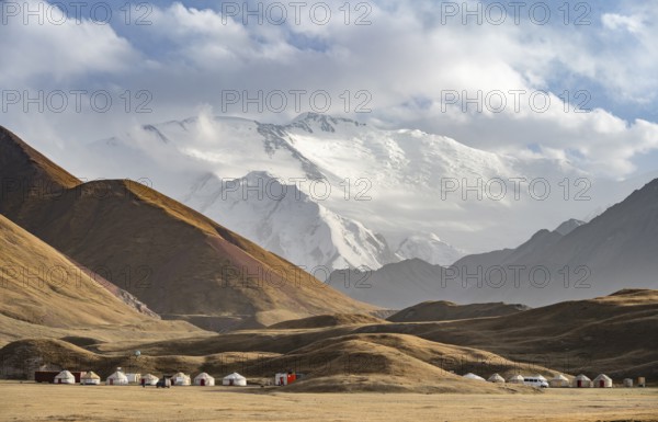 Yurts in front of Lenin Peak, Pamir Mountains, Osh Province, Kyrgyzstan, Asia