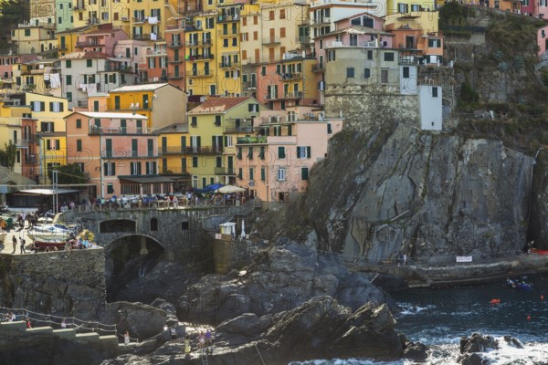 Colourful multi storied stucco cladded residentialapartment buildings in Manarola village, Cinque Terre, La Spezia, Italy, Europe