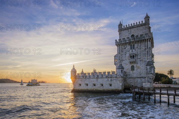 Belem Tower or Tower of St Vincent, famous tourist landmark of Lisboa and tourism attraction, on the bank of the Tagus River Tejo on sunset. Lisbon, Portugal, Europe