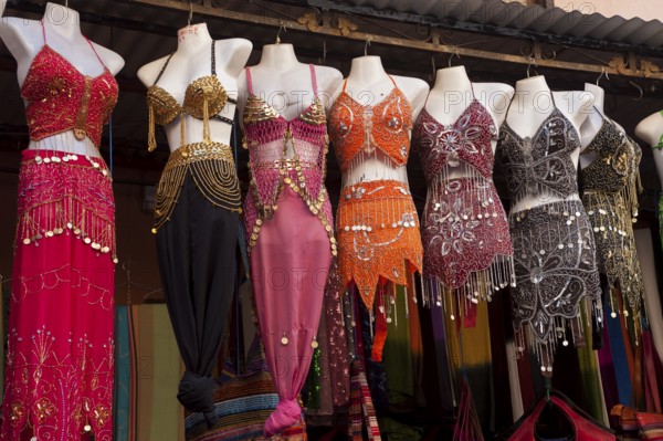 Shop with dresses for belly dance in the Medina, shopping, souvenir, clothing, tradition, traditional, Muslim, Arabic, Islam, religion, symbol, symbolic, woman, woman's clothing, Marrakech, Morocco, Africa