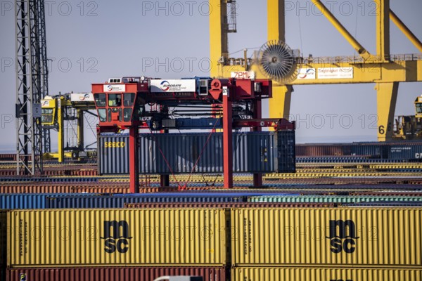 Container terminal in the seaport of Bremerhaven, Eurogate Container Terminal with almost 50 container gantry cranes, cranes, on a length of over 4 KM at the mouth of the Weser, straddle carriers bring the containers to and from the container ships, or store them between, Bremerhaven, Bremen, Germany, Europe