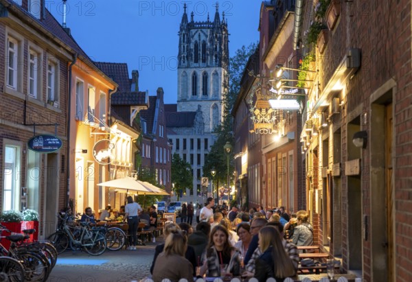 Historic old town, Kuhviertel, pub district, Kreuzstraße, tower of the Liebfrauen-Überwasserkirche, in Münster, North Rhine-Westphalia, Germany, Europe