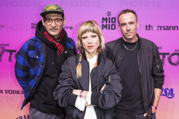 Andy Penn, Mieze Katz and Robert Bob Schütze from the band MIA. on the red carpet in front of the Polyton 2024 award ceremony at the Atelier Gardens in Berlin on 23 October 2024. The award has been held since 2023 and is a successor to the Echo music award