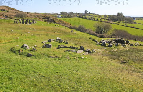 Drombeg stone circle, County Cork, Ireland, Irish Republic roundhouse Fulacht fiadh structure in foreground, Europe