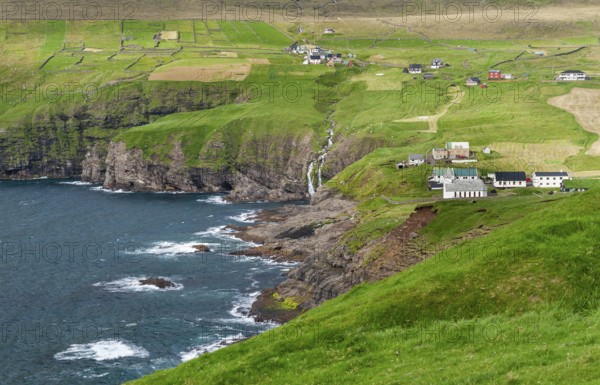 Fields and village on rocky coast, Vidareidi, Vidoy Island, Viðareiði, Viðoy Island, Faroe Islands, Denmark, Europe