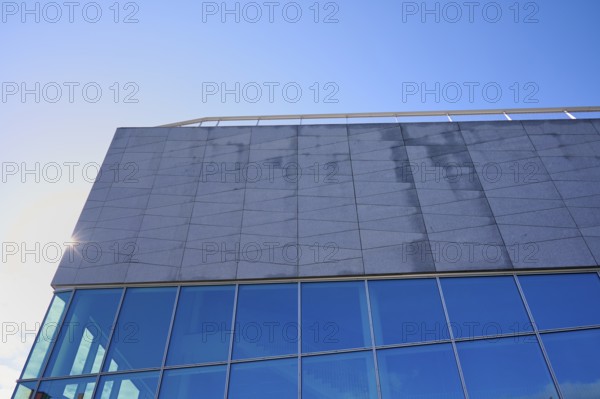 Modern building More og Romsdal Art Centre with glass front and reflecting blue sky, Molde, Romsdal, Norway, Europe