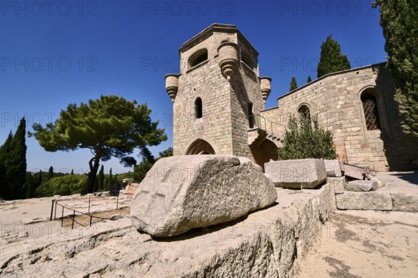 Monastery of Our Lady of Mount Filerimos, A medieval stone tower on a sunny day surrounded by cypresses, Filerimos, hill not far from Rhodes town, Ancient State of Ialyssos, Rhodes, Dodecanese, Greek Islands, Greece, Europe