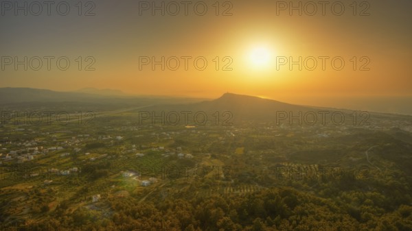 View from Filerimos hill in southwest direction, wide landscape with mountains at sunset in orange sky, Filerimos, hill not far from Rhodes town, Ancient State of Ialyssos, Rhodes, Dodecanese, Greek Islands, Greece, Europe