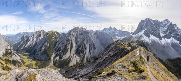 Panorama, view into Falzthurntal, mountaineer on a hiking trail on the ridge of Hahnkampl, mountain panorama with rocky steep peaks, view of summit Lamsenspitze, Karwendel Mountains, Alpenpark Karwendel, Tyrol, Austria, Europe