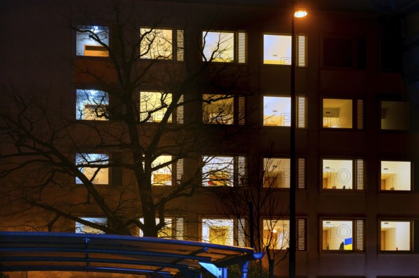 Evening facade of the university hospital with illuminated rooms, Erlangen, Middle Franconia, Bavaria, Germany, Europe