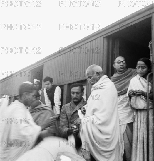 Mahatma Gandhi collecting funds for untouchables at a train station on his way to Assam - MODEL RELEASE NOT AVAILABLE