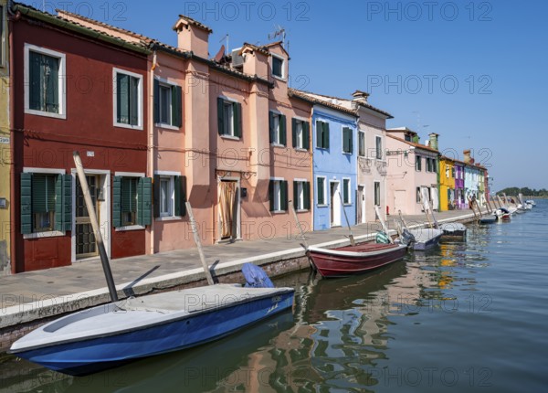 Colourful houses on the canal, canal with boats and colourful house facades, Burano Island, Venice, Veneto, Italy, Europe