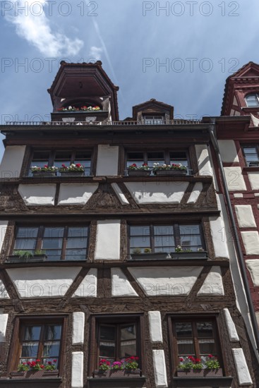 Historic half-timbered house with roof lift bay, Untere Krämergasse 18, Nuremberg, Middle Franconia, Bayernm, Germany, Europe