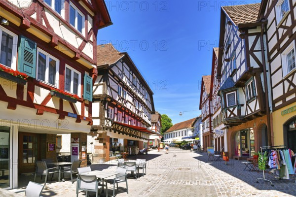 Mosbach, Germany, June 2021: Historic town center with timber-framed houses in main street on sunny day, Europe