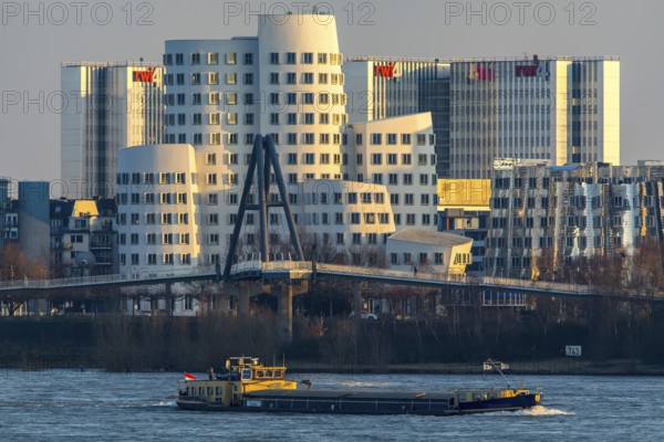 Düsseldorf, the Gehry buildings, Neuer Zollhof, in the media harbour, behind the RWI4 building complex, Rhine, cargo ship