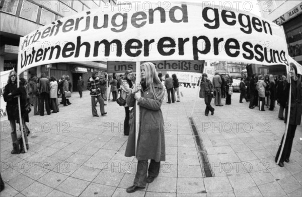 Several hundred apprentices, pupils and students demonstrated together against the reduction of apprenticeships and youth unemployment on 15.03.1975 in Essen, Germany, Europe