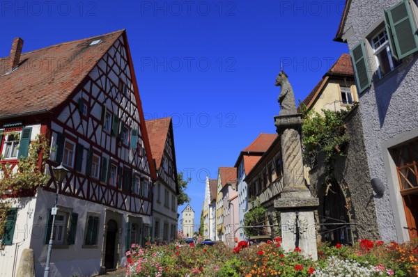 Typical Franconian village centre and the four-tube fountain in the village centre, Mainbernheim, Lower Franconia, Germany, Europe