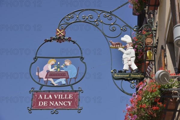 Hanging sign on an Alsatian restaurant, Eguisheim, Département Haut-Rhin, Alsace, France, Europe