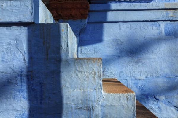 Stairs of blue painted house in Jodhpur, aka Blue City due to the vivid blue-painted Brahmin houses around Mehrangarh Fort. Jodphur, Rajasthan