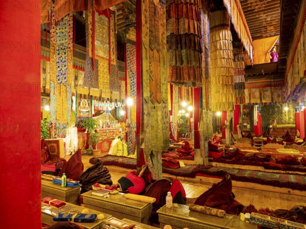 Cloths, fabrics and red columns in the Palcho Monastery, Gyangze, Tibet, China, Asia