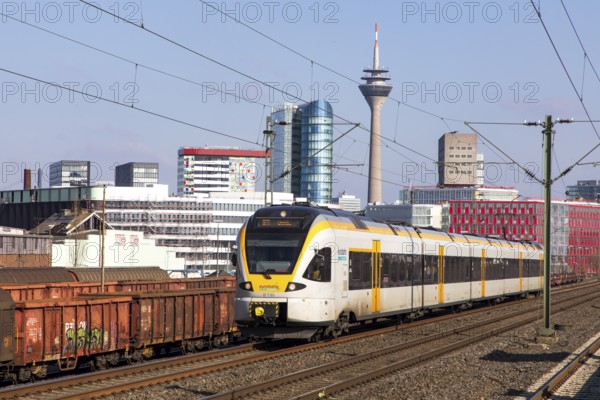 S-Bahn station, Düsseldorf-Hamm stop, Düsseldorf city centre skyline, Media Harbour, local train, Eurobahn train