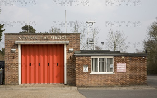 Red doors of small fire station at Loddon, Norfolk, England, United Kingdom, Europe