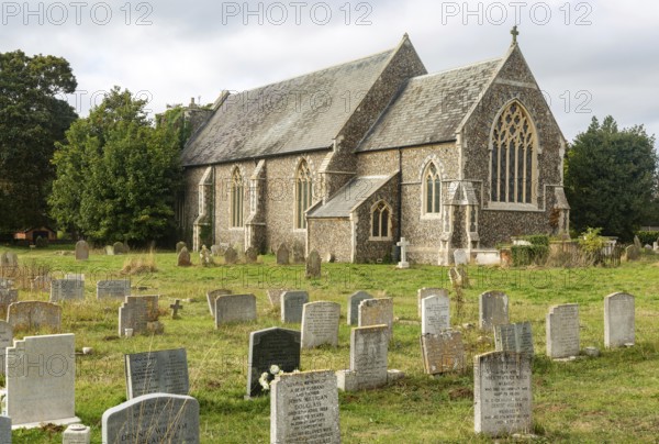 Gravestones in churchyard church of Saint Andrew, Alderton, Suffolk, England, UK