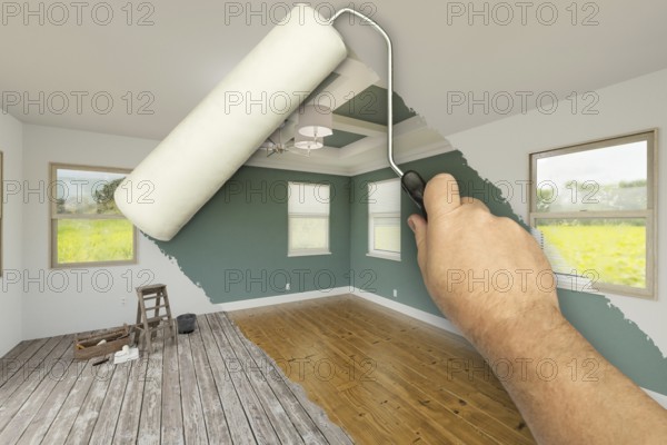 Before and after of man using A paint roller to reveal newly remodeled room with fresh green paint, coffered ceiling and new floors