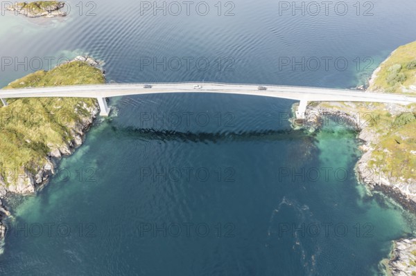 Aerial view of bridge connecting islands at the norwegian coast, cars on the one lane bridge, Norway, Europe