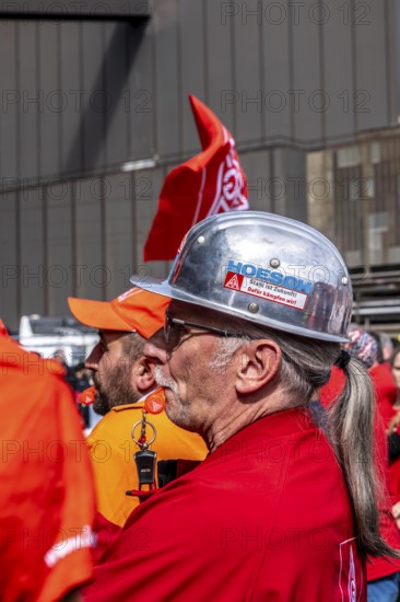 Steelworkers at a demonstration in front of the headquarters of ThyssenKrupp Steel Europe in Duisburg, against massive job cuts, after the participation of a foreign investor in the group, in the background the Oxygen steelworks, Duisburg North Rhine-Westphalia, Germany, Europe